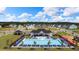 Community pool with ample seating and a splash pad offers residents a refreshing escape on sunny days at 166 Aster Avenue, Locust Grove, GA 30248