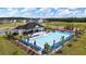 Community pool with ample seating offers residents a refreshing escape and active playground for active families at 166 Aster Avenue, Locust Grove, GA 30248