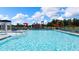 Community pool offers a refreshing escape with its sparkling water, ample seating, and a fun splash pad for all ages at 166 Aster Avenue, Locust Grove, GA 30248