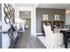 Inviting dining room featuring a rustic table setting and access to the living area at 166 Aster Avenue, Locust Grove, GA 30248