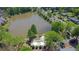 Aerial view of a community pool and lake surrounded by lush greenery at 2500 Waterstone Way, Marietta, GA 30062