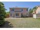 Spacious backyard with a two-story house in the background at 2500 Waterstone Way, Marietta, GA 30062