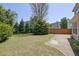 Well-manicured backyard with lush green grass and mature trees at 2500 Waterstone Way, Marietta, GA 30062