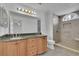 Beautiful bathroom with double vanity, granite countertop, and tiled walk-in shower at 2500 Waterstone Way, Marietta, GA 30062