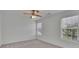 Bright bedroom featuring two windows offering natural light, neutral carpet, and a ceiling fan at 2500 Waterstone Way, Marietta, GA 30062