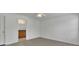 Neutral bedroom offers hardwood flooring, white walls and an archway to bathroom at 2500 Waterstone Way, Marietta, GA 30062