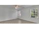 Bright bedroom featuring hardwood flooring, two windows offering natural light, and a ceiling fan at 2500 Waterstone Way, Marietta, GA 30062