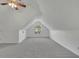 Bright bonus room featuring neutral carpeting, fan, white walls, and window at 2500 Waterstone Way, Marietta, GA 30062