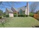 Charming home features a well-manicured front lawn, and an inviting entrance at 2500 Waterstone Way, Marietta, GA 30062