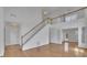 Open foyer showcases hardwood floors, a staircase, and abundant natural light at 2500 Waterstone Way, Marietta, GA 30062