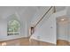 Open foyer showcases hardwood floors, a staircase, and abundant natural light at 2500 Waterstone Way, Marietta, GA 30062