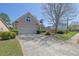 Charming home features a well-maintained front yard and two-car garage at 2500 Waterstone Way, Marietta, GA 30062