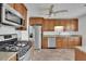 Well-lit kitchen with granite countertops and stainless steel appliances at 2500 Waterstone Way, Marietta, GA 30062