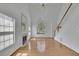 Bright living room boasts a fireplace, tall ceilings, and gleaming hardwood floors at 2500 Waterstone Way, Marietta, GA 30062