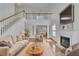 Cozy living room features a fireplace, hardwood floors, and comfortable seating at 2500 Waterstone Way, Marietta, GA 30062