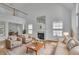 Bright living room boasts a fireplace, tall ceilings, and gleaming hardwood floors at 2500 Waterstone Way, Marietta, GA 30062