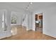 Sun-filled living room with hardwood floors, fireplace, and large arched window at 2500 Waterstone Way, Marietta, GA 30062