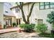 Backyard featuring brick patio and mature landscaping at 305 Heards Ferry Rd, Atlanta, GA 30328