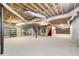 Unfinished basement with exposed ceiling and carpeted floor at 305 Heards Ferry Rd, Atlanta, GA 30328