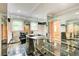 Unique bathroom features a double vanity, marble floors and walls of mirrors at 305 Heards Ferry Rd, Atlanta, GA 30328
