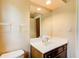 Simple bathroom with white countertop sink, mirror, and toilet; neutral, clean aesthetic at 305 Heards Ferry Rd, Atlanta, GA 30328