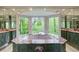 An elegant bathroom offers a garden tub with great views at 305 Heards Ferry Rd, Atlanta, GA 30328