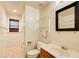 Bathroom featuring a glass shelf and a wood-trimmed vanity at 305 Heards Ferry Rd, Atlanta, GA 30328