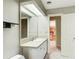 Bathroom features a vanity and a door leading to a hallway at 305 Heards Ferry Rd, Atlanta, GA 30328