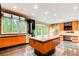 Contemporary kitchen with island, sleek cabinetry, natural light, and backyard views at 305 Heards Ferry Rd, Atlanta, GA 30328