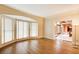 Bright living room with hardwood floors and large bay windows, offering ample natural light and a serene view at 305 Heards Ferry Rd, Atlanta, GA 30328
