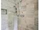 Modern shower with dual shower heads and marble tile at 305 Heards Ferry Rd, Atlanta, GA 30328