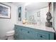 Stylish bathroom featuring a granite countertop, teal cabinets, and modern fixtures and decor at 3665 Essex Ave # 28, Atlanta, GA 30339
