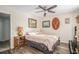 This bedroom features a ceiling fan and hardwood floors, bathed in sun light at 3665 Essex Ave # 28, Atlanta, GA 30339