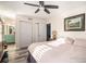 Sunlit bedroom with hardwood floors, closets and an ensuite teal bathroom at 3665 Essex Ave # 28, Atlanta, GA 30339
