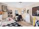 Cozy bedroom with a desk, shelving, and a whiteboard for creative expression at 3665 Essex Ave # 28, Atlanta, GA 30339