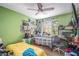 Lively bedroom featuring two beds, colorful decor, a ceiling fan and a lot of personal items at 3665 Essex Ave # 28, Atlanta, GA 30339