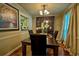 Dining room featuring a wooden table and chairs, a built-in cabinet, and a bright window at 3665 Essex Ave # 28, Atlanta, GA 30339