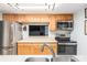 Bright kitchen with stainless steel appliances, a double sink and a passthrough to another room at 3665 Essex Ave # 28, Atlanta, GA 30339