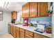 Kitchen featuring oak cabinets, light countertop, and stainless steel appliances at 3665 Essex Ave # 28, Atlanta, GA 30339