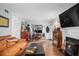Bright living room featuring hardwood floors, fireplace, and ample seating at 3665 Essex Ave # 28, Atlanta, GA 30339