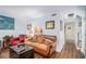 Cozy living room showing open access to kitchen area, hardwood floors, and artwork at 3665 Essex Ave # 28, Atlanta, GA 30339
