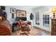 Comfortable home office featuring hardwood floors, french doors, and two monitors at 3665 Essex Ave # 28, Atlanta, GA 30339