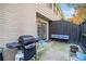 Cozy patio with brick walls, grill, outdoor bench, and entry to the home at 3665 Essex Ave # 28, Atlanta, GA 30339