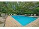 Community pool surrounded by lounge chairs for relaxation and enjoying the summer weather at 3665 Essex Ave # 28, Atlanta, GA 30339