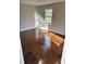 Bright bedroom with gleaming wood floors and natural light coming through the window at 4844 Fairforest Dr, Stone Mountain, GA 30088