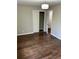 Cozy bedroom with wood-look floors, closet, and neutral paint, creating a serene atmosphere at 4844 Fairforest Dr, Stone Mountain, GA 30088