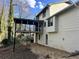 Exterior elevation of the home showcasing the expansive back yard and screened patio at 4844 Fairforest Dr, Stone Mountain, GA 30088