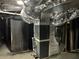 The basement features a modern furnace with ductwork and a hot water tank at 4844 Fairforest Dr, Stone Mountain, GA 30088