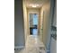 Bright hallway featuring marble floors and an open view to the adjacent living space at 4844 Fairforest Dr, Stone Mountain, GA 30088