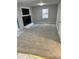 The living room features plush carpeting, neutral colors, and a brick fireplace at 4844 Fairforest Dr, Stone Mountain, GA 30088